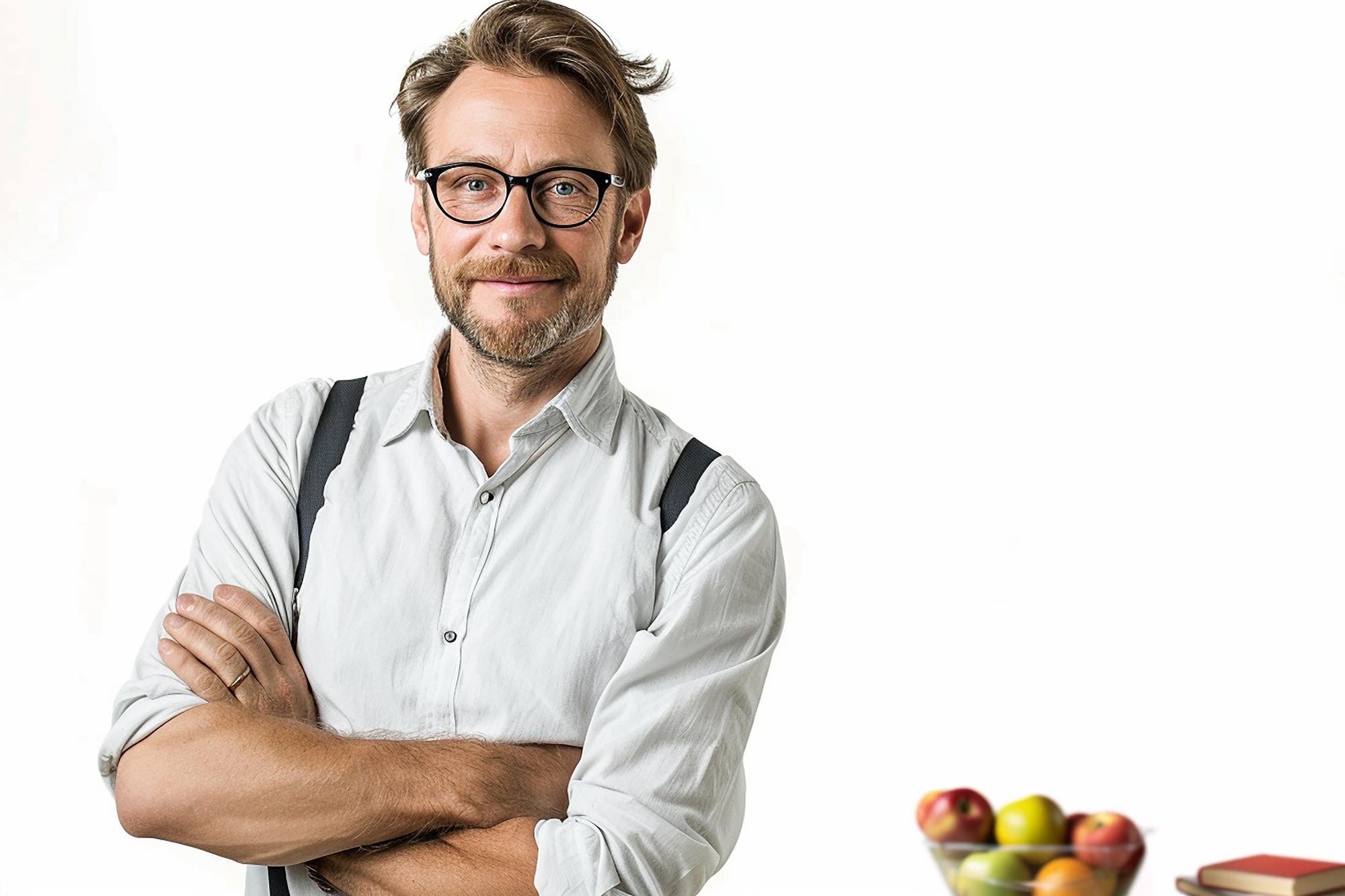 Instructor smiling in a refined kitchen studio
